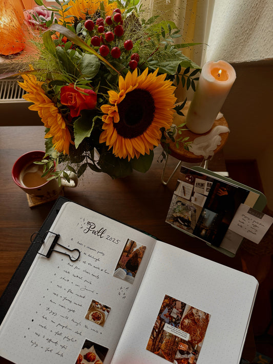 Creative fall journal with autumn bucket list items, sunflowers and pumpkin spice latte