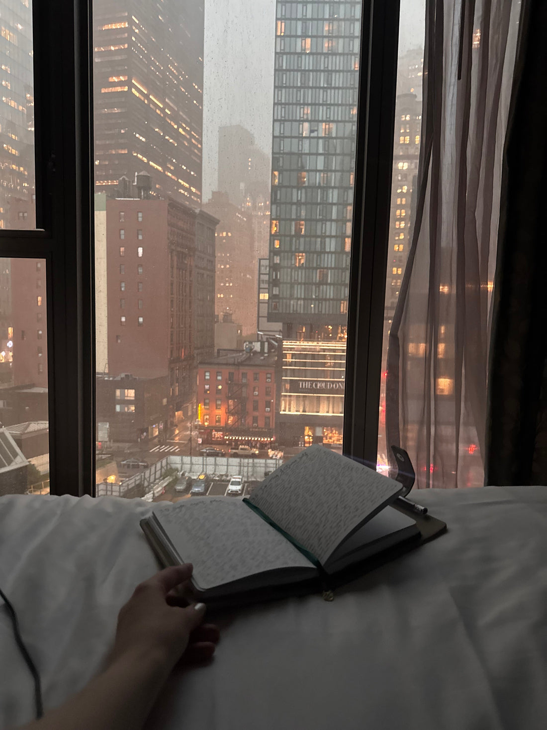Introvert journaling about life in a big city, finding quiet moments and peace and cozy moments in loud surroundings