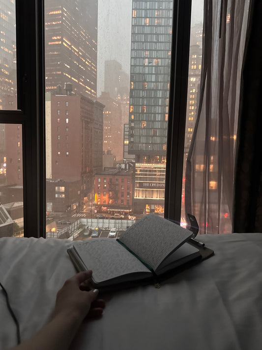 Introvert journaling about life in a big city, finding quiet moments and peace and cozy moments in loud surroundings